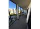 Screened balcony with table and chairs, offering a relaxing outdoor space at 4119 61St Avenue W Ter # 308, Bradenton, FL 34210