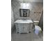 Updated bathroom with white vanity, marble countertop, and tile shower at 4119 61St Avenue W Ter # 308, Bradenton, FL 34210