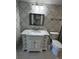 Updated bathroom with white vanity, marble countertop, and tile shower at 4119 61St Avenue W Ter # 308, Bradenton, FL 34210