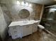 Bathroom with granite countertop, white vanity, and tile flooring at 4119 61St Avenue W Ter # 308, Bradenton, FL 34210
