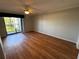 Spacious bedroom with laminate wood flooring and sliding door to balcony at 4119 61St Avenue W Ter # 308, Bradenton, FL 34210
