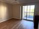 Bright bedroom with laminate flooring and sliding glass door to balcony at 4119 61St Avenue W Ter # 308, Bradenton, FL 34210