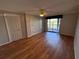 Bright bedroom with laminate flooring and access to balcony at 4119 61St Avenue W Ter # 308, Bradenton, FL 34210