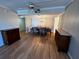 Open concept dining room with hardwood floors, a table and chairs at 4119 61St Avenue W Ter # 308, Bradenton, FL 34210