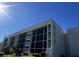 Modern condominium building with bright white exterior and screened balconies at 4119 61St Avenue W Ter # 308, Bradenton, FL 34210
