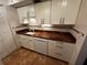 Kitchen with white cabinets, granite countertops and dishwasher at 4119 61St Avenue W Ter # 308, Bradenton, FL 34210