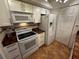 Bright kitchen with white cabinets, granite countertops, and modern appliances at 4119 61St Avenue W Ter # 308, Bradenton, FL 34210