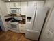 White kitchen cabinets, granite countertops and tile flooring at 4119 61St Avenue W Ter # 308, Bradenton, FL 34210