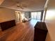 Spacious living room with hardwood floors and access to other rooms at 4119 61St Avenue W Ter # 308, Bradenton, FL 34210