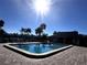 Community pool with lounge chairs and patio area at 4119 61St Avenue W Ter # 308, Bradenton, FL 34210