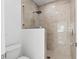Modern bathroom featuring a glass-enclosed shower with tiled walls and a rain shower head at 4316 Callista Ln, Sarasota, FL 34243