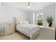 Bright bedroom with a comfortable bed, natural light, and stylish furnishings at 4316 Callista Ln, Sarasota, FL 34243