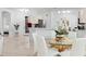 Open-concept dining area featuring an elegant table and chairs adjacent to a modern kitchen at 4316 Callista Ln, Sarasota, FL 34243