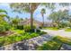 Charming single-story home with well-manicured lawn and mature trees in a sunny neighborhood at 4316 Callista Ln, Sarasota, FL 34243