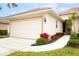 Charming single-story home featuring a well-maintained lawn, lovely landscaping and attached garage at 4316 Callista Ln, Sarasota, FL 34243