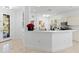Open kitchen area with white cabinetry, granite countertops, and stainless steel appliances at 4316 Callista Ln, Sarasota, FL 34243