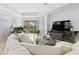 Bright and airy living room with modern furnishings and view to outdoor living space at 4316 Callista Ln, Sarasota, FL 34243