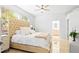 Inviting main bedroom with a plush bed, accent lighting, and an en-suite bathroom at 4316 Callista Ln, Sarasota, FL 34243