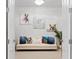Sitting room with neutral decor and artwork of dogs, creating a cozy and inviting space at 4316 Callista Ln, Sarasota, FL 34243