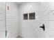 Modern shower features white marble tile, and a built-in niche at 4317 Windemere Pl, Sarasota, FL 34231