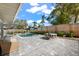 Inviting pool area with patio furniture and lush landscaping at 4317 Windemere Pl, Sarasota, FL 34231