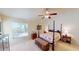 Spacious bedroom with a four-poster bed and ample closet space at 4425 Fairway Dr, North Port, FL 34287