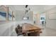 Dining area features a wood table and bench seating at 4711 Arpino Ct, Bradenton, FL 34211