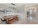 Dining room with a wood table, bench seating, and modern light fixture at 4711 Arpino Ct, Bradenton, FL 34211