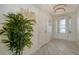 Bright foyer with tile flooring and a potted plant at 4711 Arpino Ct, Lakewood Ranch, FL 34211