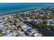 Aerial view of canal-front property with water access and nearby beach at 519 South Dr, Anna Maria, FL 34216