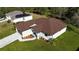 New home with brown roof and driveway, viewed from above at 5210 Fries Ave, North Port, FL 34288