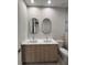 Modern bathroom with double vanity and sleek mirrors at 5274 Neon Ave, North Port, FL 34291