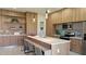 Modern kitchen with wood cabinets, stainless steel appliances, and an island at 5274 Neon Ave, North Port, FL 34291