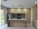 Modern kitchen with large island and plenty of cabinet space at 5274 Neon Ave, North Port, FL 34291