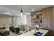 Open concept kitchen and living area with modern finishes and island at 5274 Neon Ave, North Port, FL 34291
