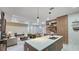 Modern kitchen island overlooks living and dining areas at 5274 Neon Ave, North Port, FL 34291