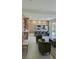 Open concept kitchen with island, stainless steel appliances, and modern cabinetry at 5274 Neon Ave, North Port, FL 34291