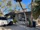 Mid-century home with large windows and a yellow door at 5453 Avenida Del Mare, Sarasota, FL 34242
