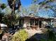 House exterior showcasing patio, landscaping, and grill at 5453 Avenida Del Mare, Sarasota, FL 34242