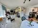 Spacious living room with a fireplace and kitchen view at 5453 Avenida Del Mare, Sarasota, FL 34242