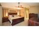 Spacious bedroom with king-size bed and wood furniture at 5715 Fern Oak Ct, Sarasota, FL 34232