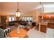 Bright dining area with a round table and access to the kitchen at 5715 Fern Oak Ct, Sarasota, FL 34232