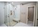 Large walk-in shower with a built-in seat and pebble floor at 5715 Fern Oak Ct, Sarasota, FL 34232