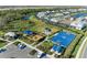 Aerial view of community amenities including playground, basketball court, and parking at 6043 Bluestar Ct, Bradenton, FL 34211