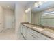 Bathroom with double vanity, granite countertop, and glass shower at 6043 Bluestar Ct, Bradenton, FL 34211