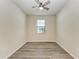 Bright bedroom with ceiling fan and vinyl plank flooring at 6043 Bluestar Ct, Bradenton, FL 34211