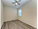 Simple bedroom with ceiling fan and vinyl flooring at 6043 Bluestar Ct, Bradenton, FL 34211