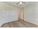 Well-lit bedroom with double doors and vinyl flooring at 6043 Bluestar Ct, Bradenton, FL 34211