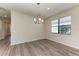 Empty dining room with wood-look floors and a chandelier at 6043 Bluestar Ct, Bradenton, FL 34211