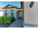 Front entrance with gray stone and a light green door at 6043 Bluestar Ct, Bradenton, FL 34211